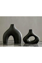 Carrot's Den Black ceramic donut vases - Set of 2. Minimalist Nordic decor for home, office & wedding centerpieces. Modern hollow design perfect for plants & flowers.