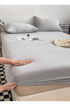 3-Piece Set: single-size fitted bedsheet and two pillowcases, washable cotton in a light grey color.